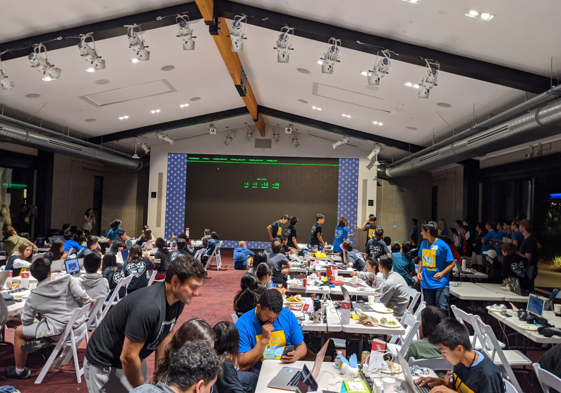 Students at AngelHacks 2019 building projects in groups.